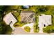 Aerial view of a suburban home showing the roof, yard, and driveway at 2418 Se 23Rd St, Ocala, FL 34471