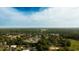 Beautiful aerial view of a residential neighborhood surrounded by trees under a clear blue sky at 2418 Se 23Rd St, Ocala, FL 34471