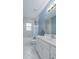 Bright bathroom featuring a white vanity, tile flooring, and a shower-tub combo at 2418 Se 23Rd St, Ocala, FL 34471