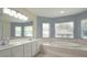 Bright bathroom features a garden tub, dual sinks and great natural light at 2418 Se 23Rd St, Ocala, FL 34471