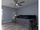 Bedroom with wood floors and a modern ceiling fan at 2418 Se 23Rd St, Ocala, FL 34471