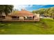 Community clubhouse featuring an outdoor gathering space overlooking green lawns at 2418 Se 23Rd St, Ocala, FL 34471