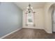 Dining room with large window, chandelier and view to the front of the property at 2418 Se 23Rd St, Ocala, FL 34471