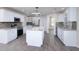 Well-equipped kitchen with white cabinets, granite counters, stainless appliances, and an island at 2418 Se 23Rd St, Ocala, FL 34471