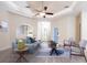 Open living room with crown moulding, archways, and updated ceiling fan at 2418 Se 23Rd St, Ocala, FL 34471