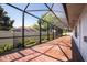 Long screened-in patio with lush landscaping at 2418 Se 23Rd St, Ocala, FL 34471
