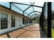 Wide view of the brick-floored patio extending down the back of the home at 2418 Se 23Rd St, Ocala, FL 34471