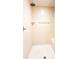 Nicely tiled shower stall featuring a rainfall shower head and built-in seating at 2418 Se 23Rd St, Ocala, FL 34471