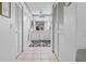 Bathroom featuring dual closets leading to sinks, cabinets, and a large mirror at 4846 Colonnades Club Blvd, Lakeland, FL 33811