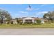Welcoming community center boasting attractive architecture and lush, well-maintained landscaping at 4846 Colonnades Club Blvd, Lakeland, FL 33811