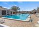 Inviting community pool surrounded by ample seating, perfect for relaxation and social gatherings at 4846 Colonnades Club Blvd, Lakeland, FL 33811