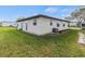 Clean home exterior with a well-kept lawn and minimal landscaping for easy maintenance at 4846 Colonnades Club Blvd, Lakeland, FL 33811