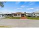 Charming home with a well-maintained lawn, inviting driveway, and cozy curb appeal at 4846 Colonnades Club Blvd, Lakeland, FL 33811