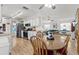 Inviting open floor plan showcasing a seamless flow between the kitchen, dining area, and living space at 4846 Colonnades Club Blvd, Lakeland, FL 33811