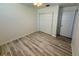Empty bedroom with light-colored floors, a ceiling fan, and ample closet space at 1618 Pineberry St, Lakeland, FL 33803