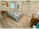 Well-lit bedroom with coastal-themed decor, light-colored floors, and ample natural light at 1618 Pineberry St, Lakeland, FL 33803