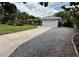 Long driveway and mature landscaping create great curb appeal for this home at 1618 Pineberry St, Lakeland, FL 33803