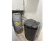 Utility room features a new water heater and water filtration system at 1618 Pineberry St, Lakeland, FL 33803