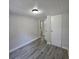Bedroom featuring updated lighting and gray vinyl plank flooring at 2434 Trenton E Rd, Lakeland, FL 33815