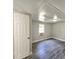 Bedroom with gray wood floors and white walls at 2434 Trenton E Rd, Lakeland, FL 33815