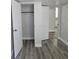 Closet featuring new gray vinyl plank flooring and door to another room at 2434 Trenton E Rd, Lakeland, FL 33815