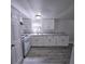 White kitchen cabinets and appliances at 2434 Trenton E Rd, Lakeland, FL 33815