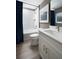 Bright bathroom features a white vanity, modern fixtures, and a bathtub-shower combination at 6236 Sw 95Th Pl, Ocala, FL 34476