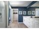 Modern bathroom featuring a glass-enclosed shower, white vanity, and blue accent wall at 6236 Sw 95Th Pl, Ocala, FL 34476