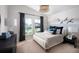 Cozy bedroom featuring a decorative wall mural and plenty of natural light at 6236 Sw 95Th Pl, Ocala, FL 34476