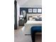 Beautiful bedroom featuring a plush bed, stylish bedside table and elegant artwork at 6236 Sw 95Th Pl, Ocala, FL 34476