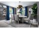Elegant dining room with stylish furnishings, decorative mirrors, and a modern chandelier at 6236 Sw 95Th Pl, Ocala, FL 34476