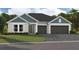 Charming single-story home with a well-manicured lawn and a convenient two-car garage at 6236 Sw 95Th Pl, Ocala, FL 34476