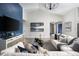 Inviting living room with a large television, comfortable seating, and stylish decor at 6236 Sw 95Th Pl, Ocala, FL 34476