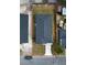 An aerial view showcases the property's layout with a defined perimeter, home, driveway, and yard space at 209 W 6Th St, Lakeland, FL 33805