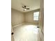 Comfortable bedroom with modern flooring, neutral walls, a ceiling fan, and a bright window view at 209 W 6Th St, Lakeland, FL 33805