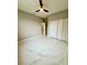 Spacious bedroom with marble floors, a ceiling fan, and a closet for storage at 209 W 6Th St, Lakeland, FL 33805