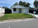 Inviting single-story home with a fresh green lawn and sleek modern design at 209 W 6Th St, Lakeland, FL 33805