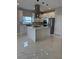 Modern kitchen featuring a quartz island, stainless steel appliances, and modern pendant lighting at 209 W 6Th St, Lakeland, FL 33805