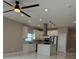 Modern kitchen with stainless steel appliances, white cabinets, a center island and recessed lighting at 209 W 6Th St, Lakeland, FL 33805