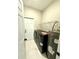 Laundry room with full size washer and dryer along with shelving at 209 W 6Th St, Lakeland, FL 33805