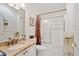 Well-maintained bathroom with granite vanity, shower and tub combination, and decorative accents at 2121 Escobar Ave, Lady Lake, FL 32159