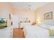 Comfortable bedroom featuring a large bed, TV, and ample space for relaxing at 2121 Escobar Ave, Lady Lake, FL 32159