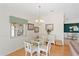 Cozy dining area with natural light, light wood floors, and neutral walls at 2121 Escobar Ave, Lady Lake, FL 32159