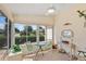 Bright sunroom with comfortable seating, a ceiling fan, and large windows at 2121 Escobar Ave, Lady Lake, FL 32159