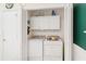 Convenient laundry area with included washer and dryer located off the dining space at 2121 Escobar Ave, Lady Lake, FL 32159