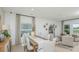 Bright dining area featuring a dining table for eight and stylish decor at 2415 Slippery Rock St, Auburndale, FL 33823