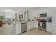 Modern open-concept kitchen featuring stainless steel appliances and a large island at 2415 Slippery Rock St, Auburndale, FL 33823