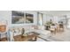Open-concept living area with a sectional sofa, and views to dining area and modern kitchen at 2415 Slippery Rock St, Auburndale, FL 33823