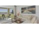 Inviting living room with a comfy sectional, neutral colors and direct access to the outdoor space at 2415 Slippery Rock St, Auburndale, FL 33823