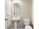 Small bathroom featuring a pedestal sink, modern faucet, and neutral color palette at 392 Summer Squall Rd, Davenport, FL 33837